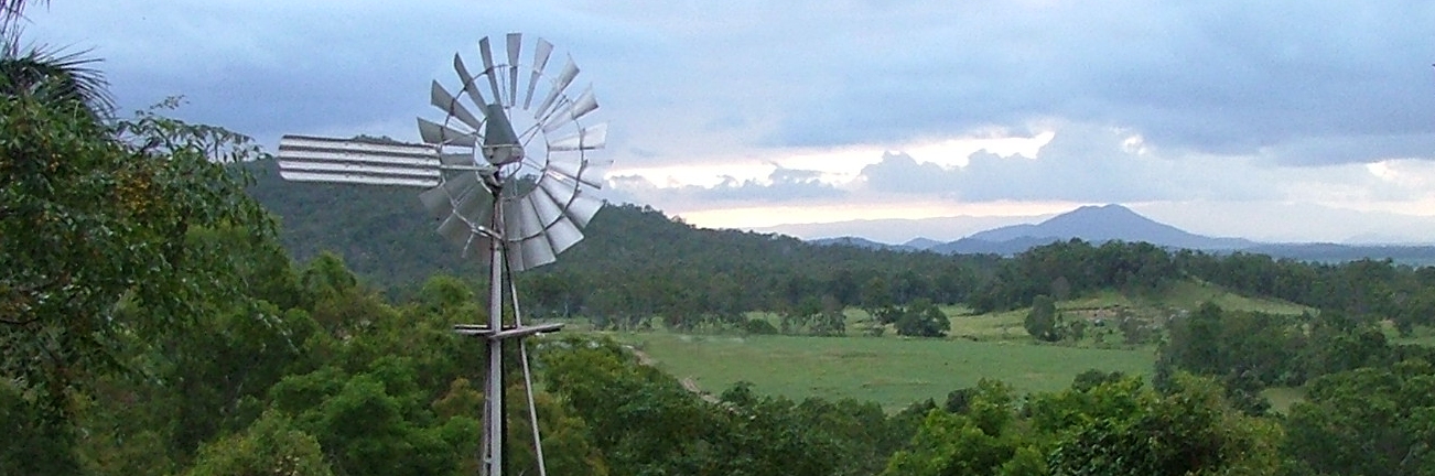 Southern cross windmill with country mountain view.